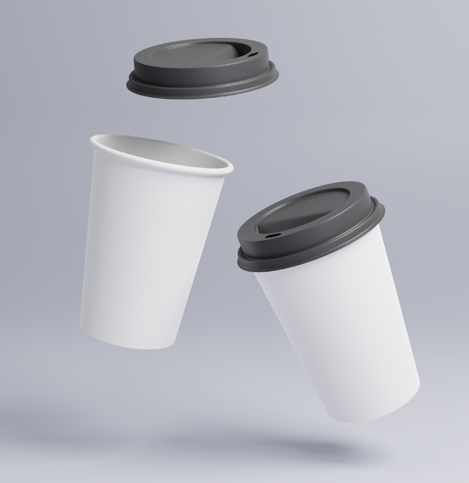 Two disposable white coffee cups with lids