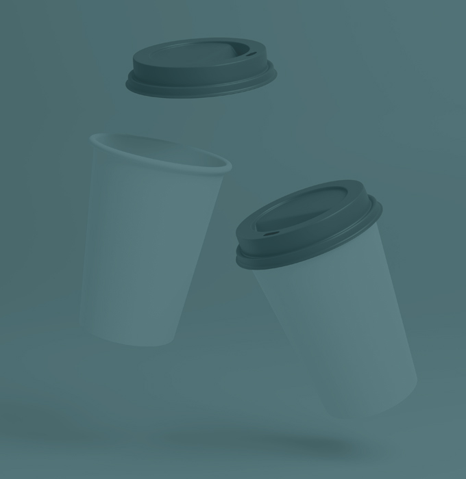 Two disposable white coffee cups with lids