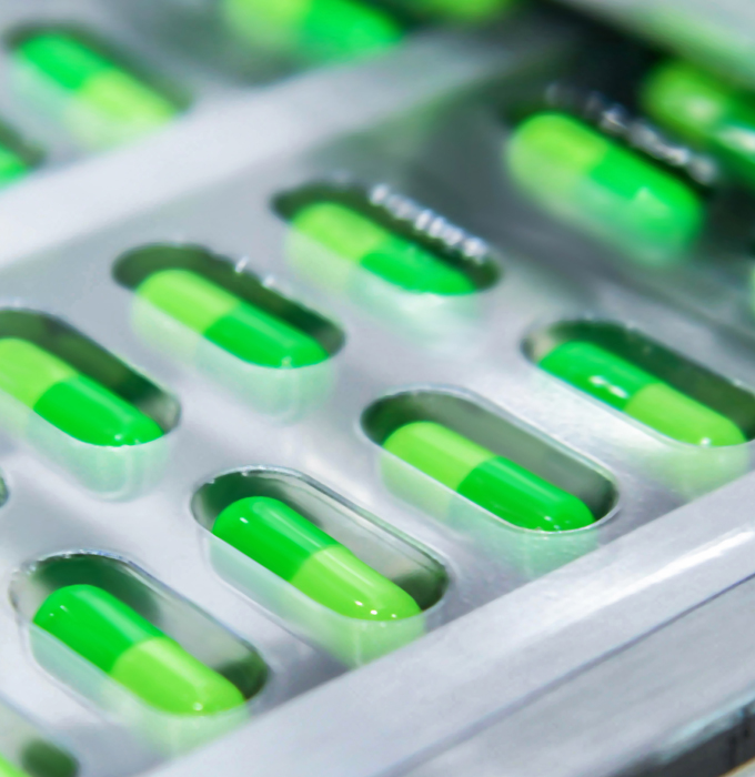 Pharma packaging with green pill capsules